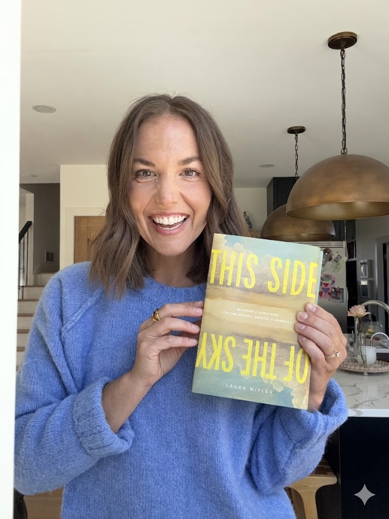 Laura Wifler holding This Side of the Sky